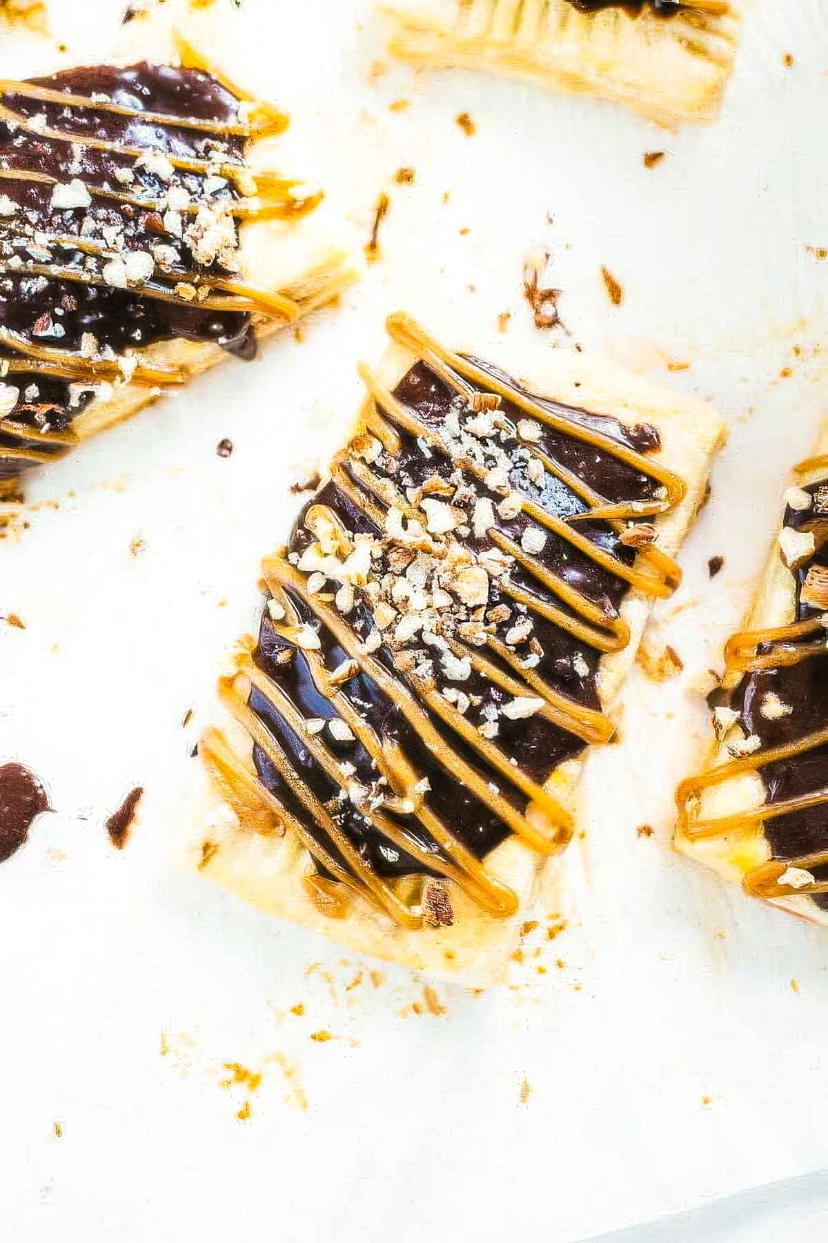 finished peanut butter pop tarts just after spreading with icing and chopped nuts