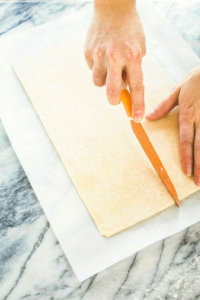 Homemade Peanut Butter Pop Tarts step 8 for making homemade peanut butter pop tarts showing how to cut the dough into 9 pieces
