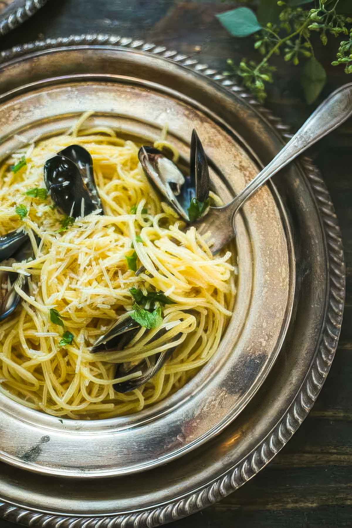 overhead shot of Mussels carbonara on a vintage plate