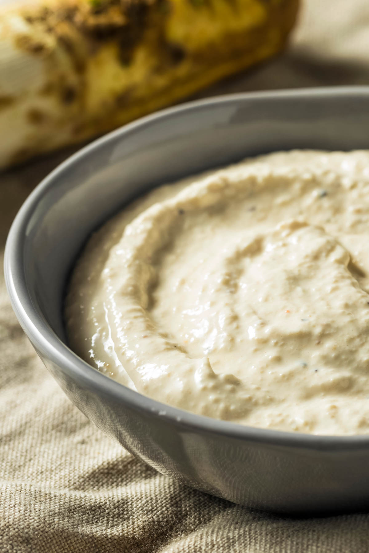 Horseradish Sauce For Prime Rib a closeup of a gray bowl filled with horseradish sauce