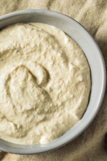 Horseradish Sauce For Prime Rib a closeup of a gray bowl filled with horseradish sauce just before serving with prime rib