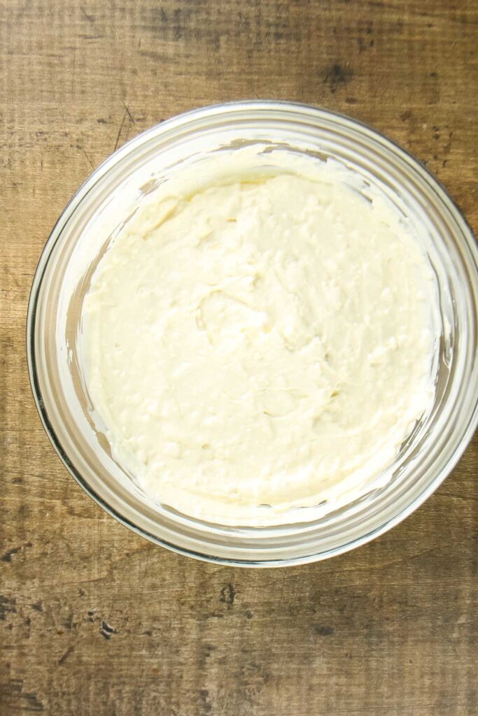 Step one of making cream cheese olive dip