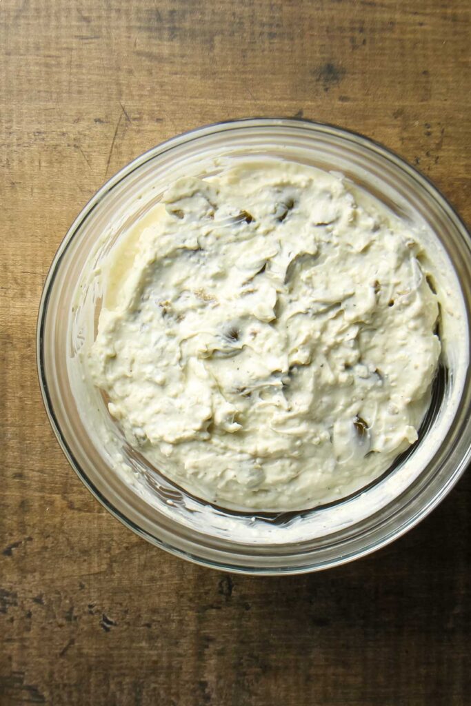 Step two of making cream cheese olive dip